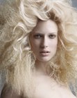 Long blonde hairdo with crimping and tiny waves