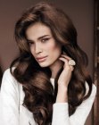 Long feminine hairstyle with waves and volume