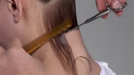 Cut an A-line bob - Cut an use the back of the comb to hold the hair still