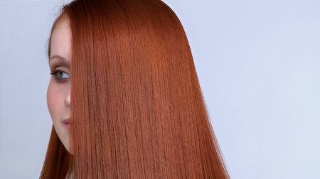 Long one length haircut creating a blanket of glossy hair