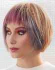 Chin length bob with point-cut bangs and block coloring