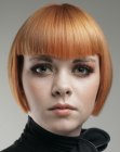 reddish blonde bob with bangs