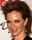Lauren Holly wearing her hair in a pixie style
