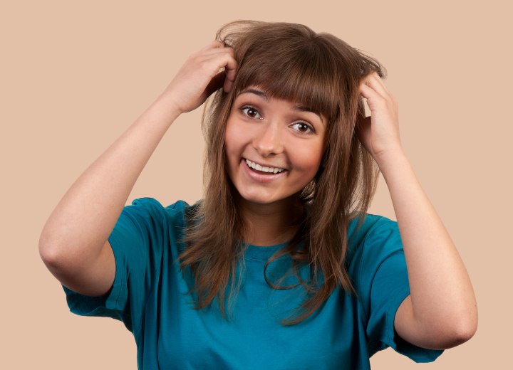 Girl who is ready to grow her bangs out