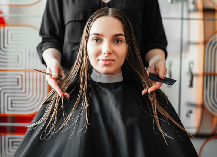 Caped girl before a long to short haircut