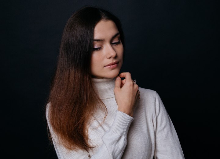 Young lady with long brown hair wearing a turtleneck