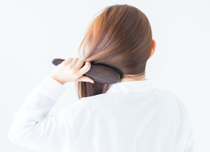 Woman who is brushing her hair