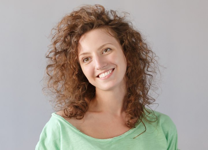 Young woman with a shoulder-length curly hairstyle