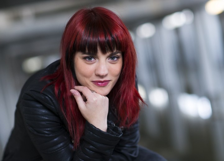 Woman with long dark red hair