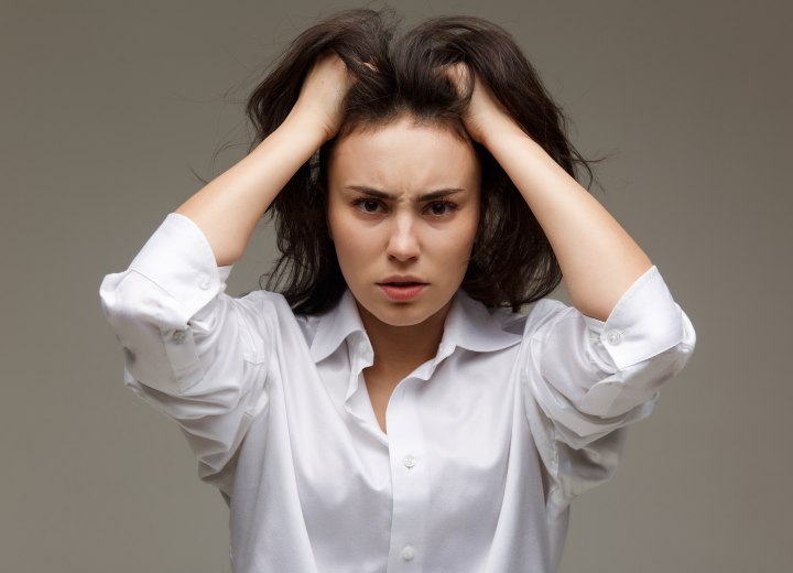 Woman with hair color stains on her forehead