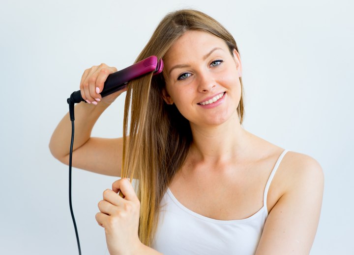 Hair straightening with a flat iron