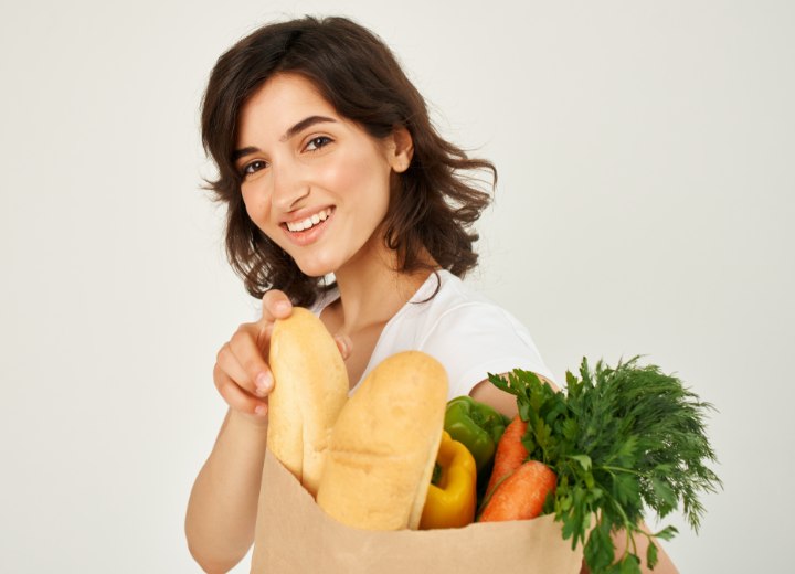 Girl with healthy food for healthy hair