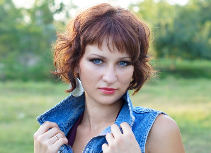 Fashionable woman with short curly hair