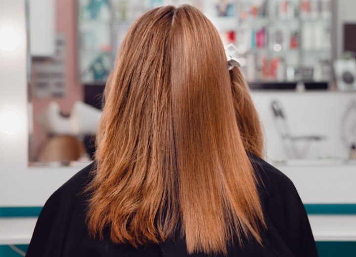 Permanent hair straightening in progress