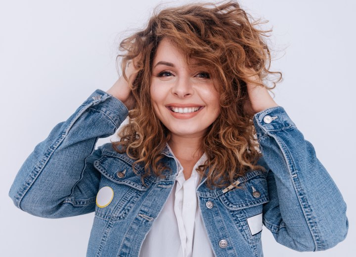 Woman with thick and curly shoulder length hair