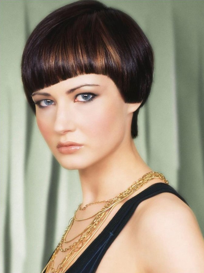 Smooth short haircut with a longer neckline and the fringe cut in an angle