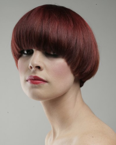 Angled bob with a heavy fringe that dominates the eyes