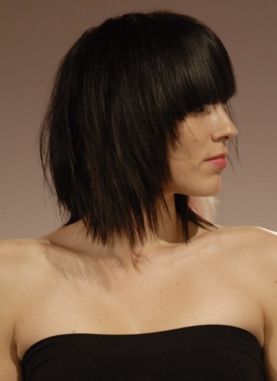 Medium length hairstyle with blunt heavy bangs