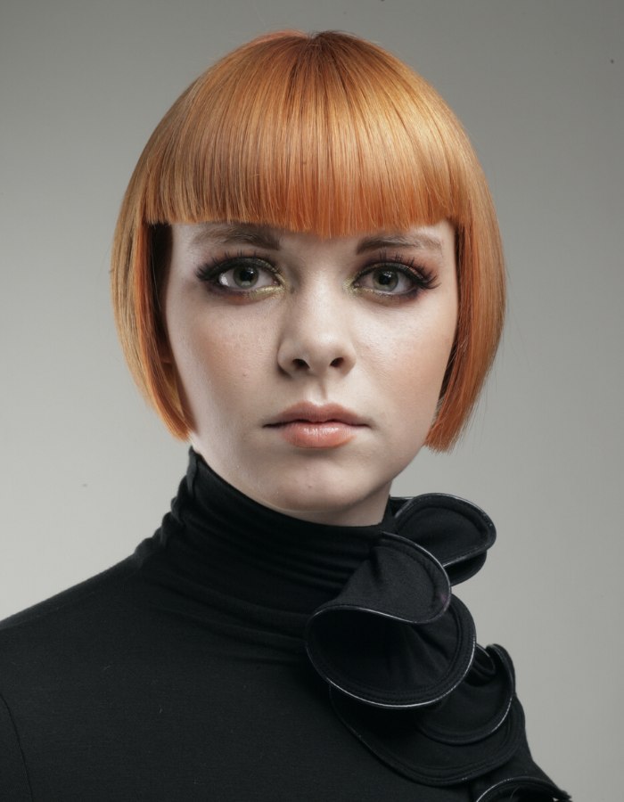 short reddish blonde under the ears bob haircut with bangs