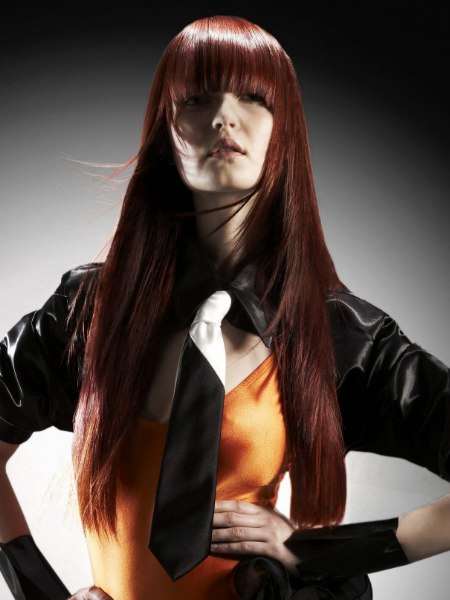 Sleek super-long style for glossy auburn hair