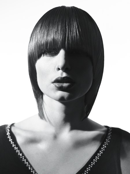 60's bob hairstyle with thick low bangs