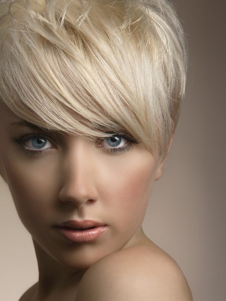 Short platinum blonde hair cut around the ears