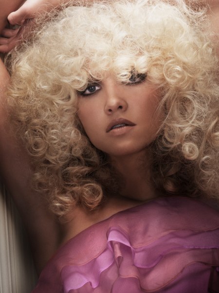 Platinum hued fine-textured hair with curls