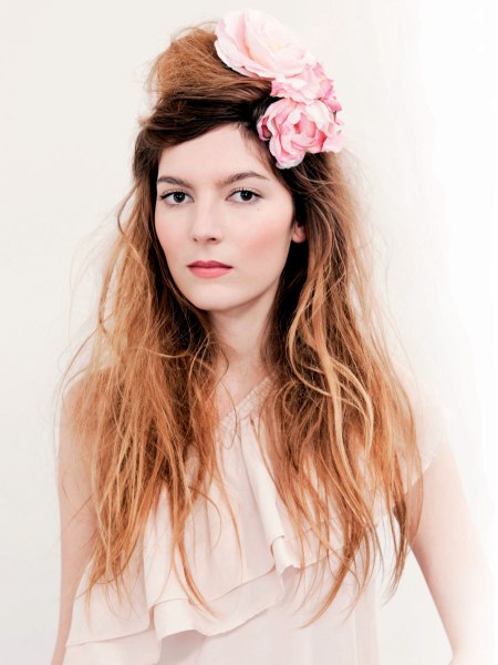 Long hair with a bun and a flower