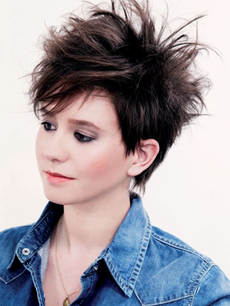 Brunette pixie cut with a steep neckline