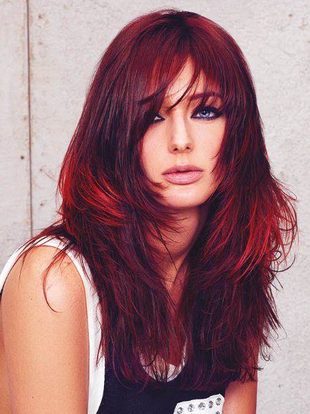 Long flamboyant hairstyle with a deep red color