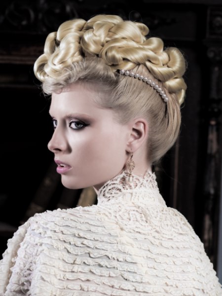 Blonde updo with twirled hair