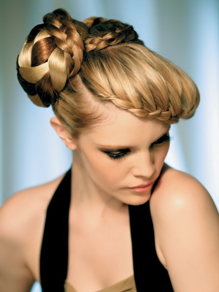 Braided knot upstyle created with an attached hairpiece