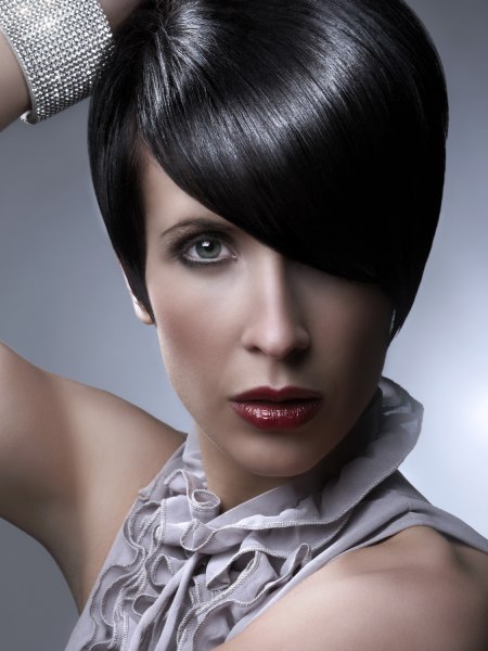 Chic short haircut with a long curved fringe