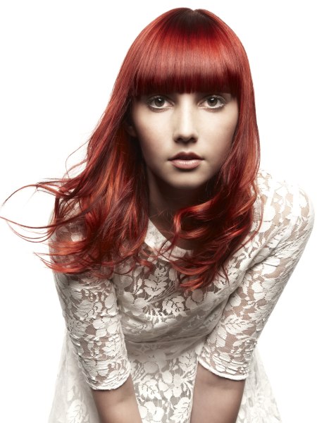 Long haircut with straight bangs for smooth red hair
