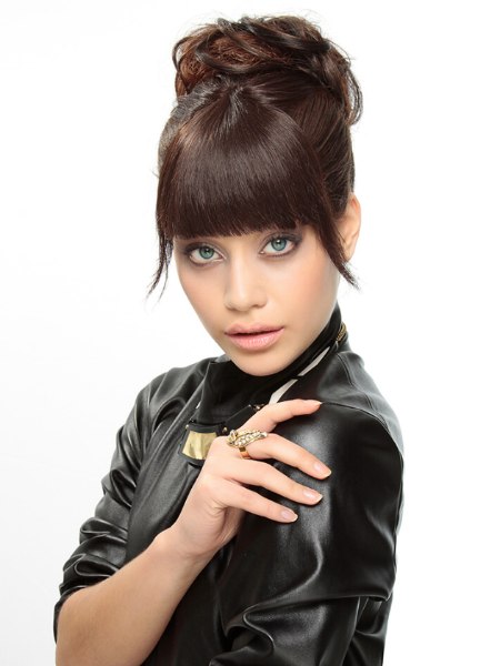 Updo with a bun and straight fringe
