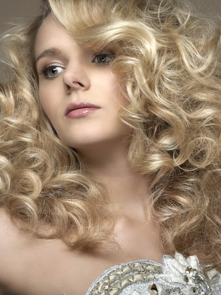 Bridal hairstyle with a full-volume cascade of curls
