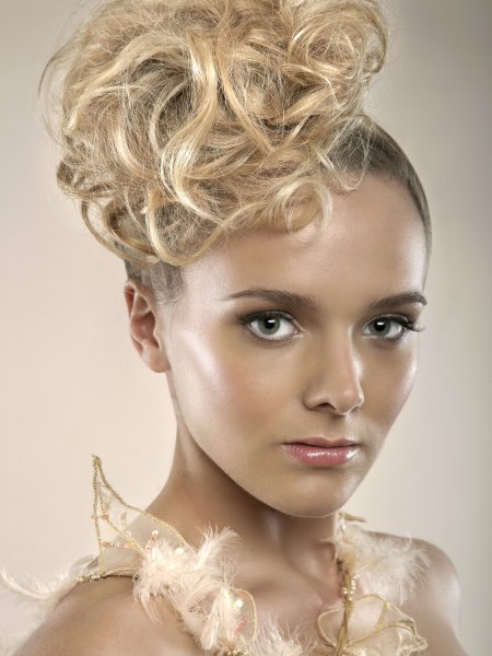 Bridal up-style with the hair drawn up smooth along the scalp