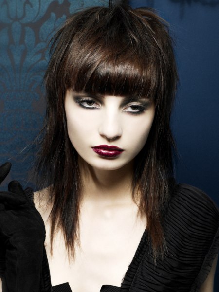 Straight razored shag hairstyle with bangs