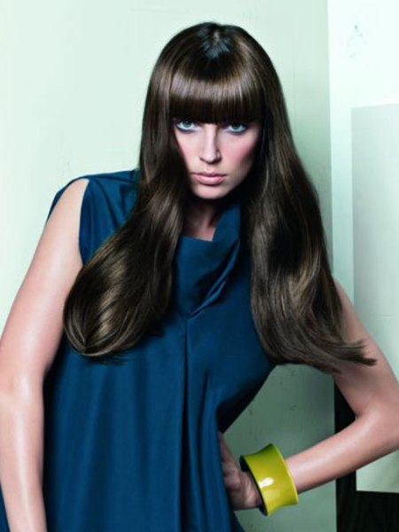 Long silky brown hair with a blunt cut fringe