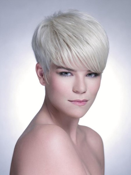 Short cropped blonde hair with a graduated neck