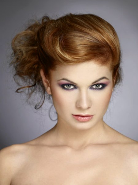Asymmetrical updo with curls cascading down the neck