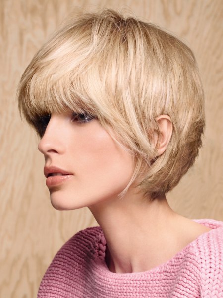 Short hair with a round back and a full thick fringe