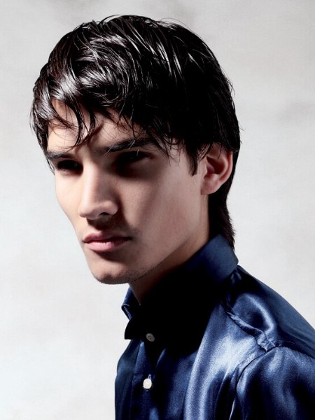 Modern men's haircut on a model wearing a satin shirt