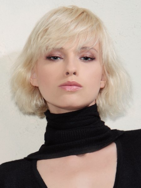 Short bob haircut with layering and a curved cutting line