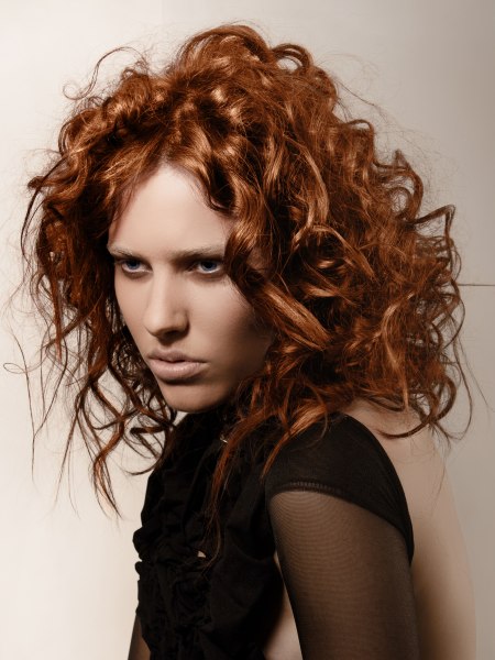 Messy styling for copper-colored hair with curls