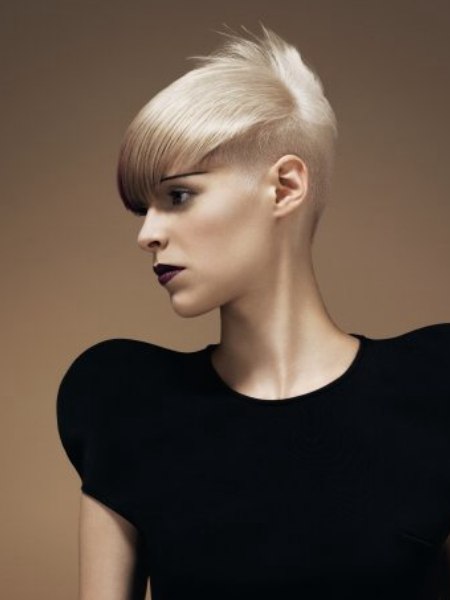 Short blonde hair with the back tapered and styled upward