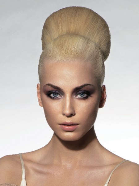 Sleek 1970 up-style for blonde hair