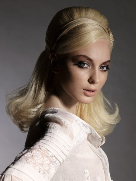 Retro look with backcombing for long blonde hair