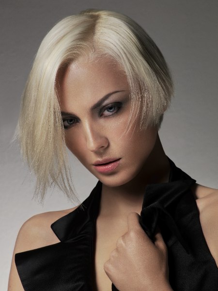 Short blonde bob styled with diffusion