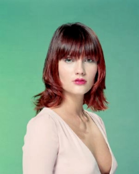 Medium haircut that blends a classic chin-length bob with soft layering